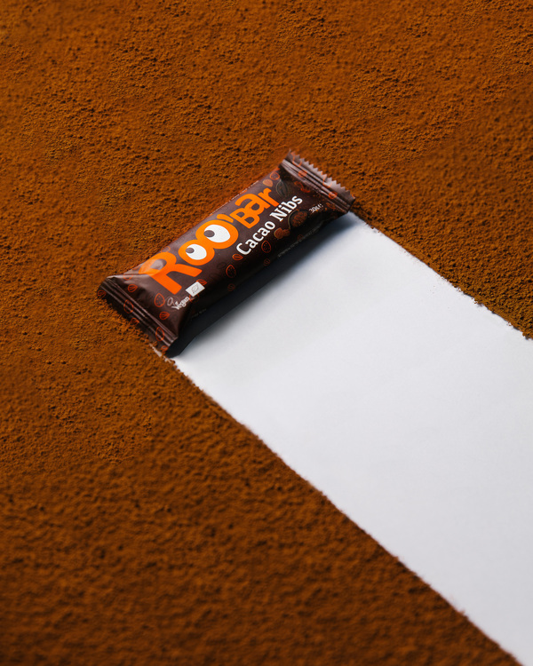 Roobar - Cacao Nibs. Roobar - Cacao Nibs. Roobar is crawling the surface made of cacao.