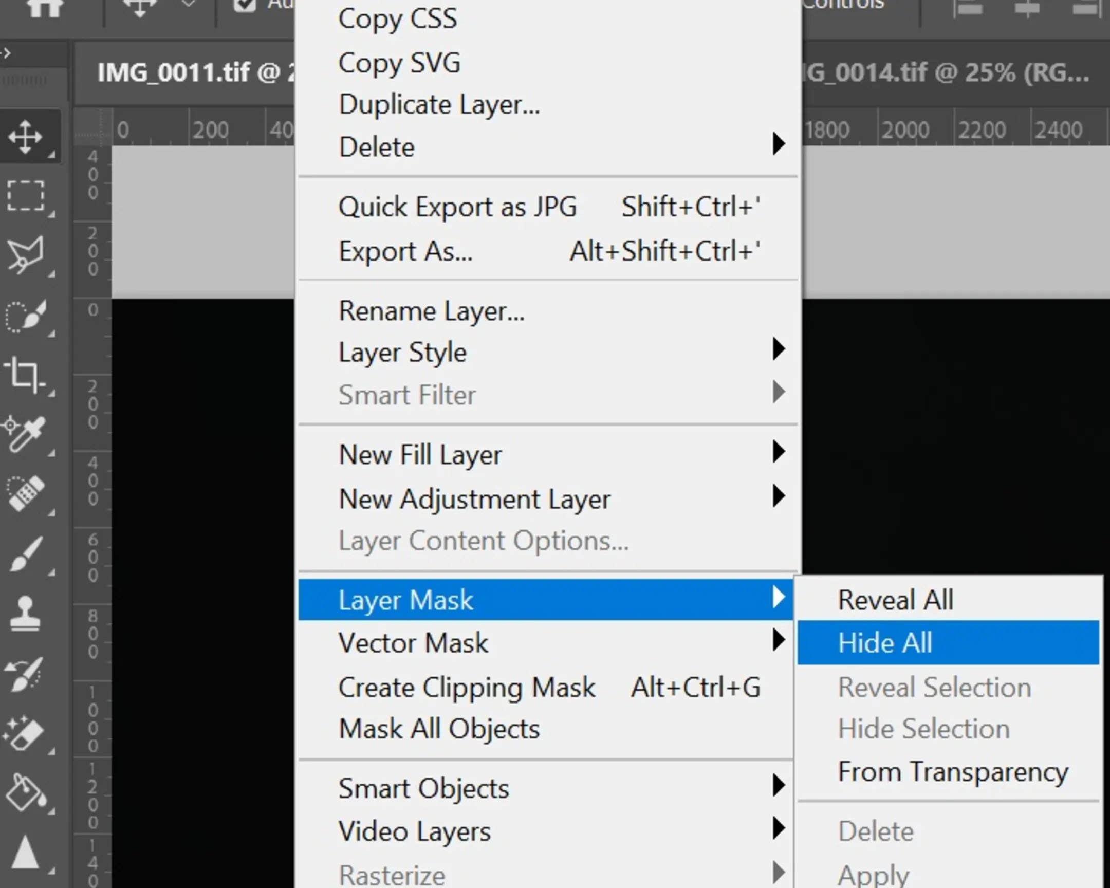 Photoshop - Layer Mask - Hide All. The photo shows an alternative way to add a black mask to a layer in Photoshop through the main menu.
