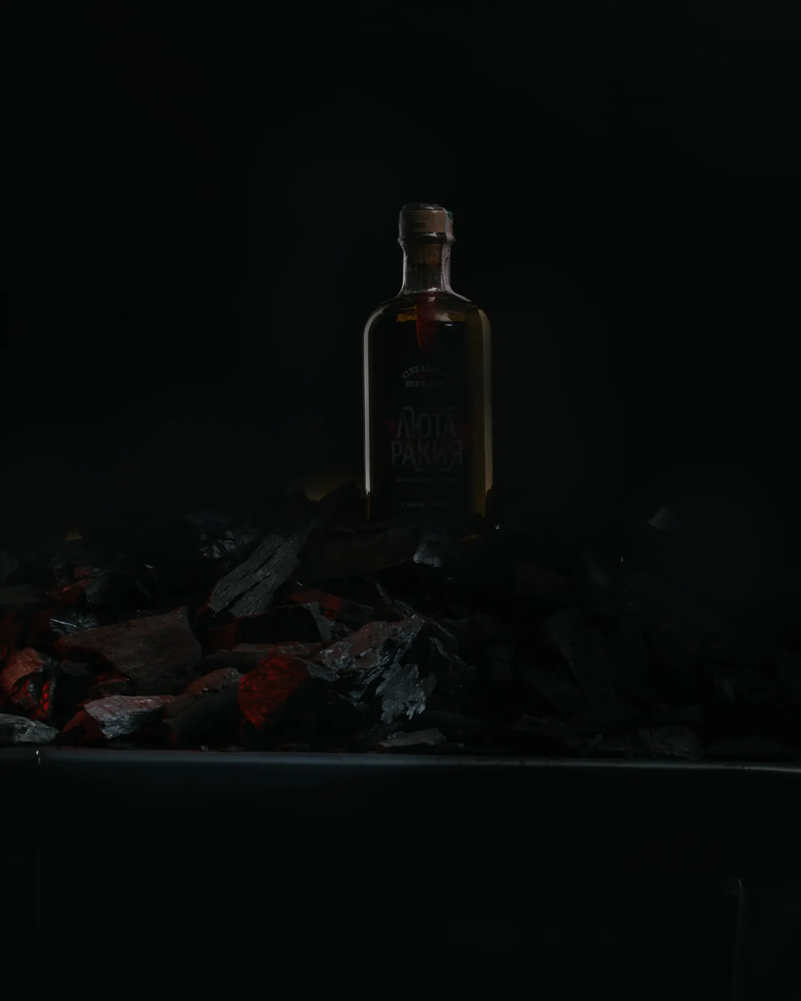 Result 3. The photo shows the result of shooting a bottle according to the light scheme shown in the second schema. The viewer sees red coals.