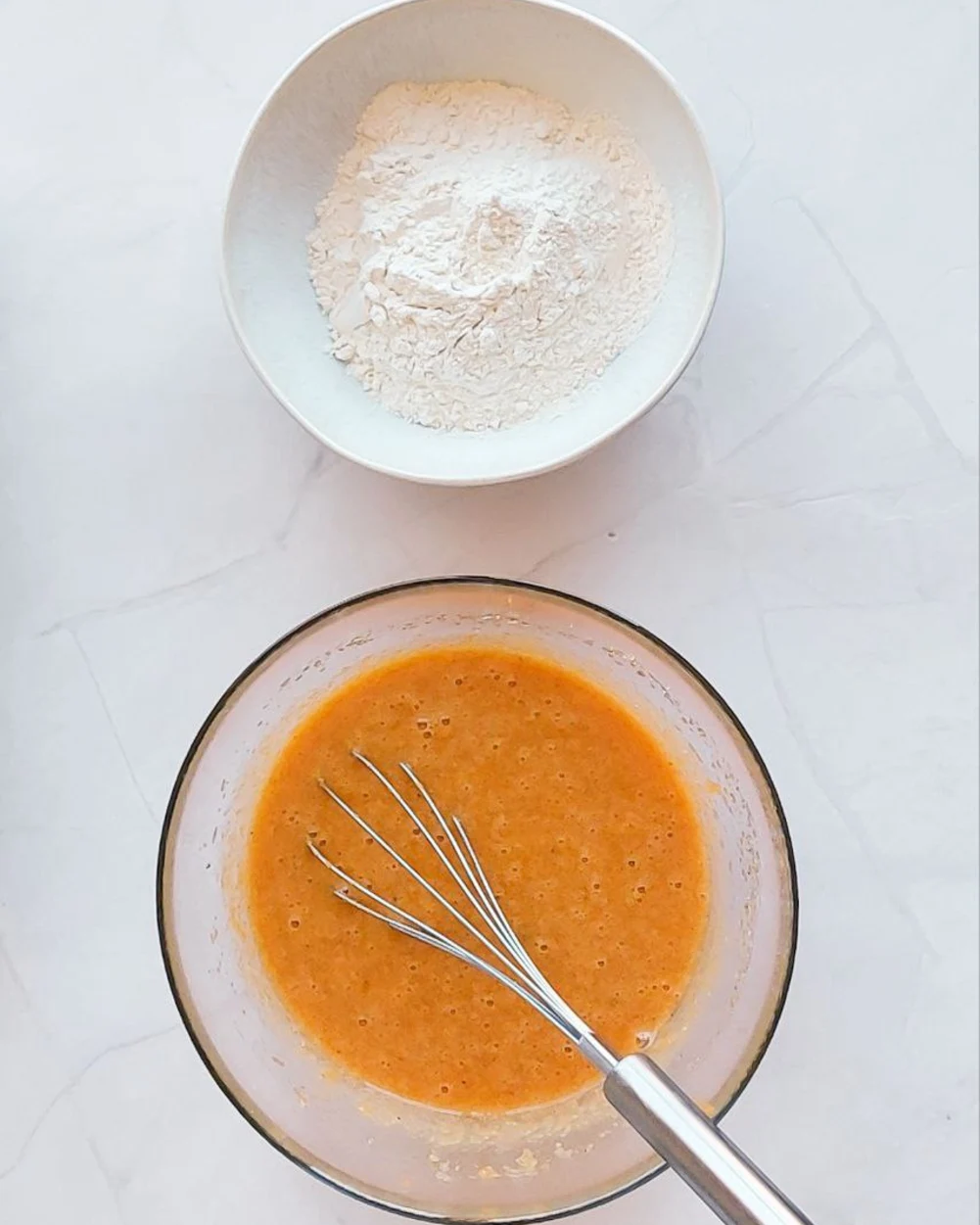 Flour part and  liquid one. There are on the table 2 plate. One is with dry part and the second is with liquid one.