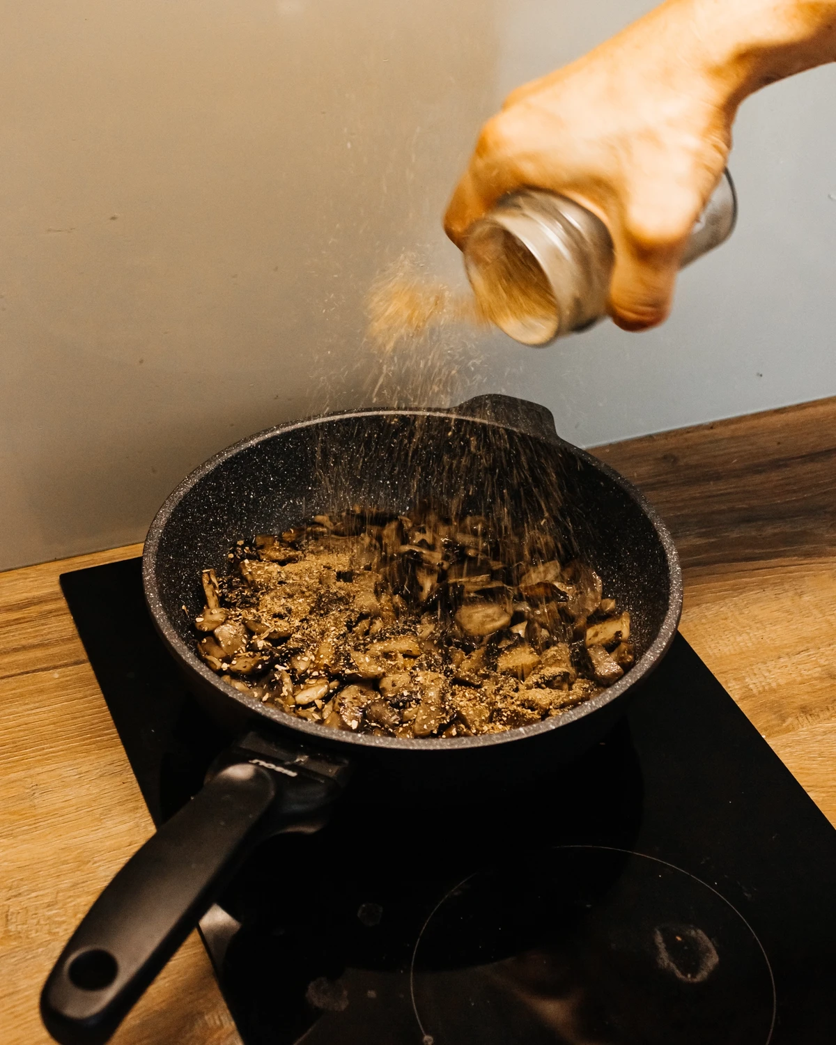 Adding dry boletus mushrooms. 