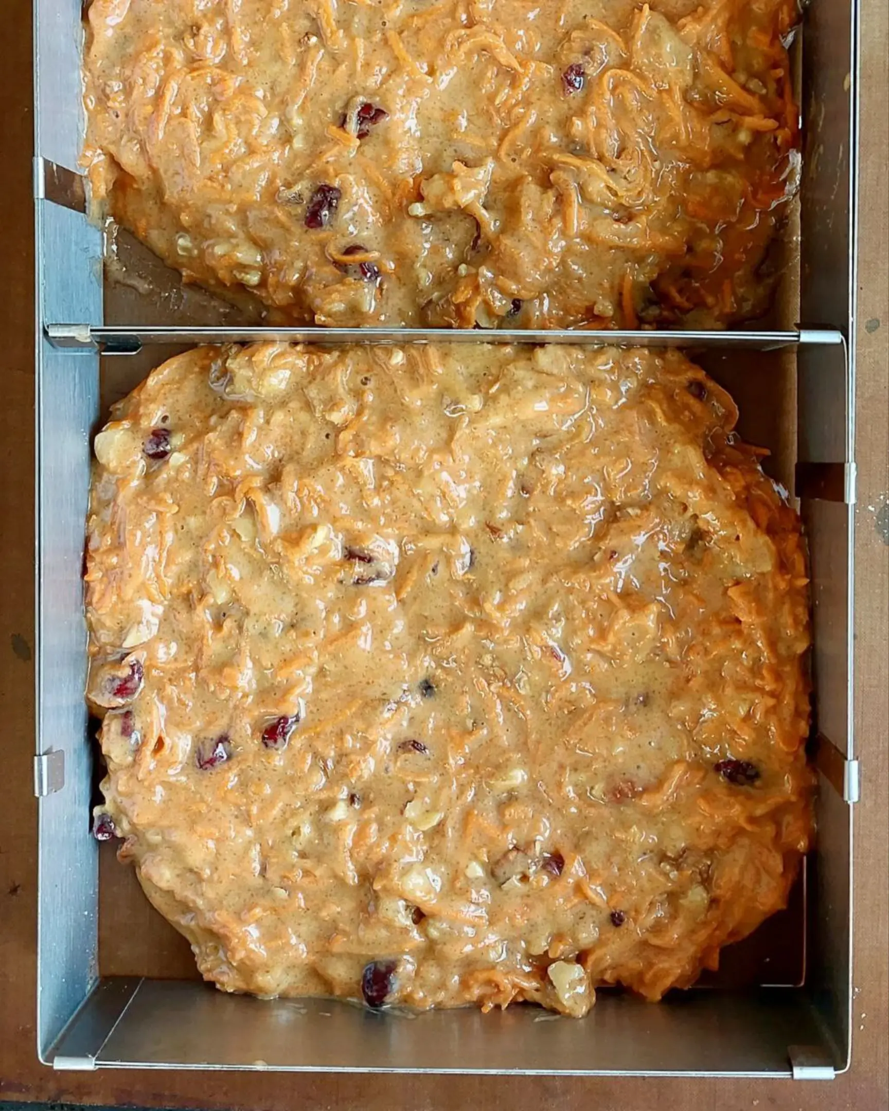 The dough for the cakes is in the baking molds . The dough for the cakes is in the baking molds and is ready to go into the oven.