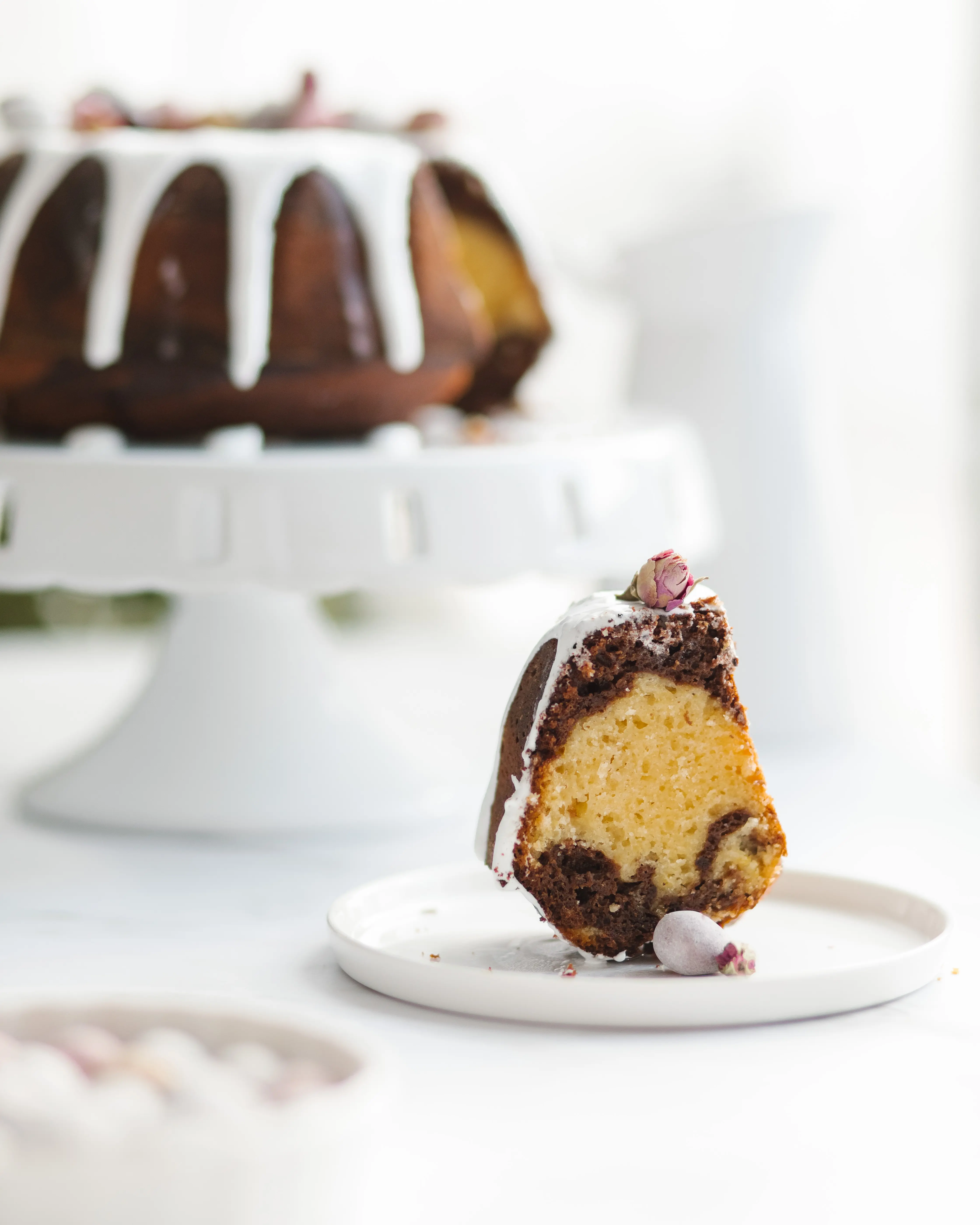 Orange chocolate cake. View from above. Orange chocolate cake. View from above. The cupcake is on the plate. The chocolate and orange portions of the cake are visible. On the next plate are cake decorations. Also in the upper left corner is a cupcake on a stand.