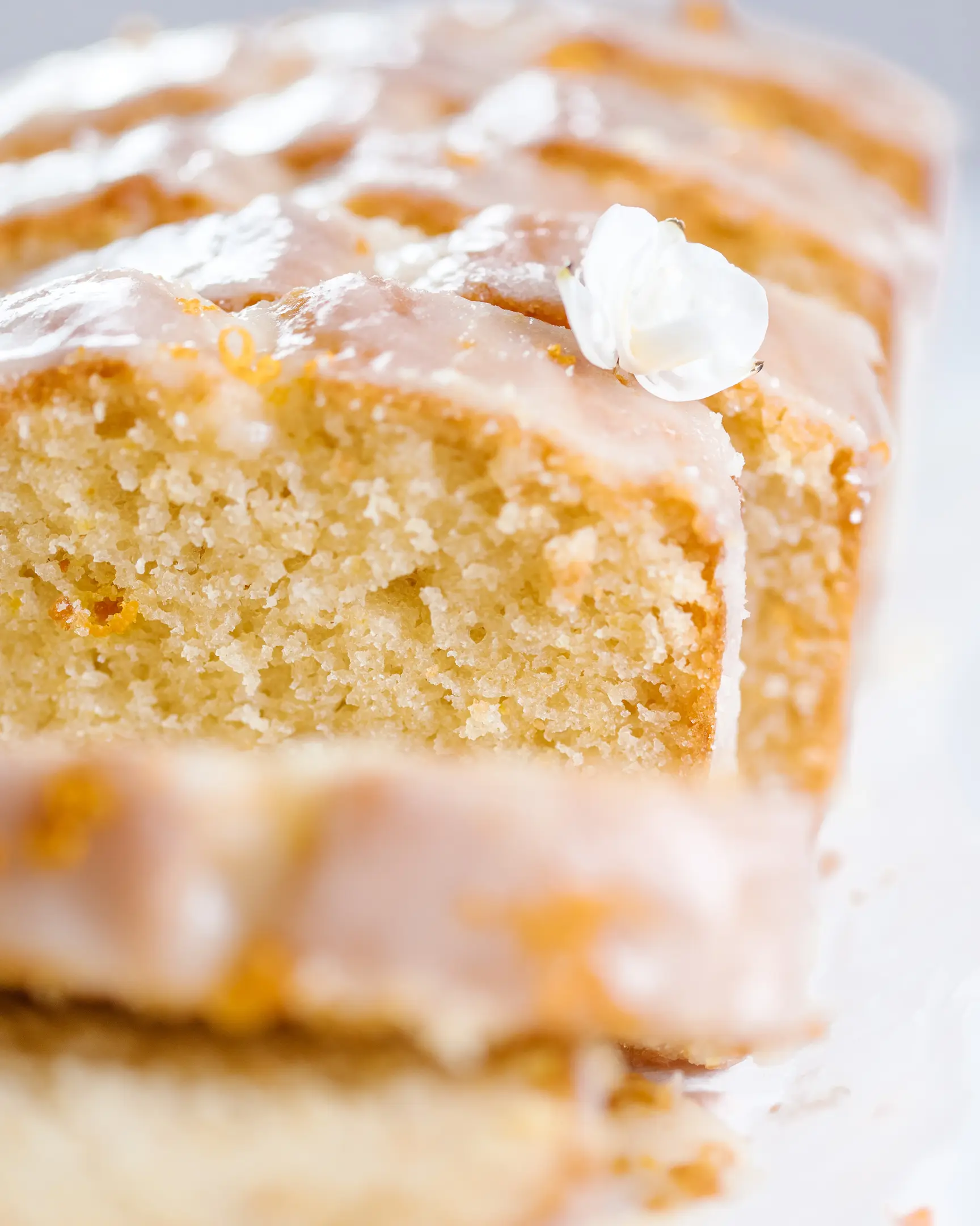 The cake is sliced.  The cake is sliced. The texture of the crumb is visible.