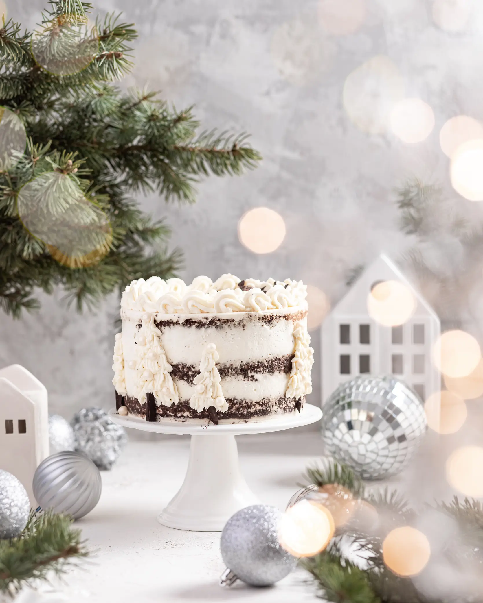 Cake standing on the table around Christmas decorations Cake standing on the table around Christmas decorations